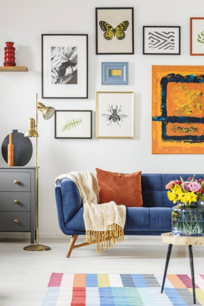 istock Blanket and pillow placed on navy blue couch standing in white l 1168423059