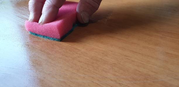 istock Table cleaning. Wipe the table with a rag. Wash the table. 1168424325