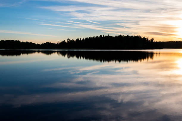 Sunset over calm lake in Sweden