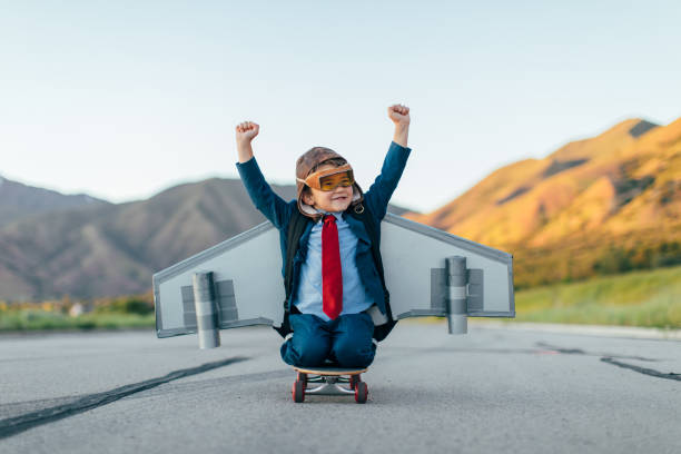 istock Young Boy Businessman Flying with Jet Pack on Skateboard 1168426313