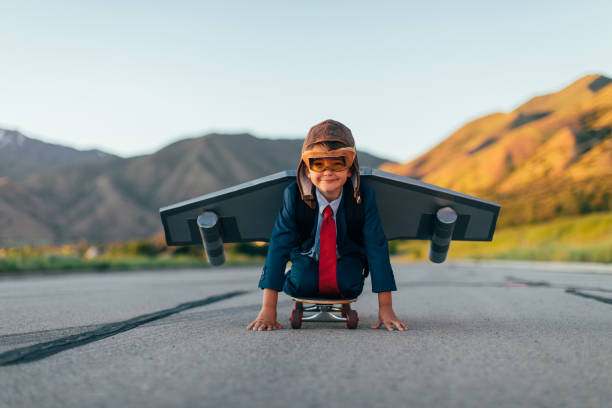 istock Young Boy Businessman Flying with Jet Pack on Skateboard 1168426316