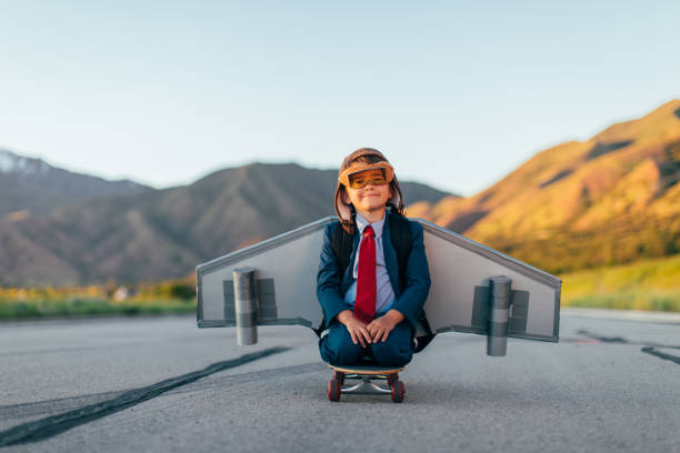 istock Young Boy Businessman Flying with Jet Pack on Skateboard 1168426317