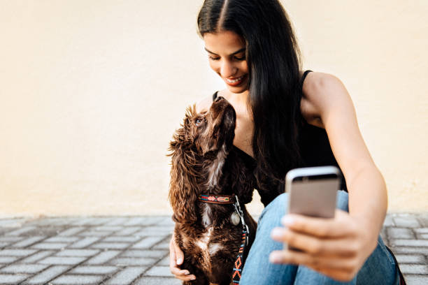 istock Woman takes a selfie with her dog 1168427530