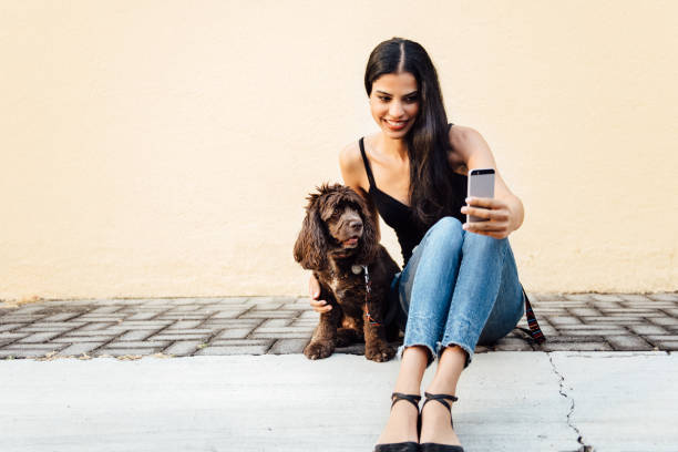Woman takes a selfie with her dog