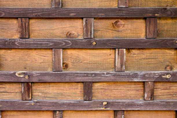 istock Wood texture. Decorative wooden bricks. Creative design. The medieval wall. 1168429478