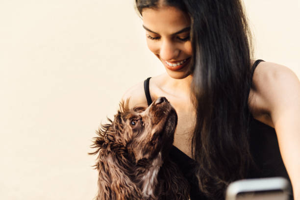 Woman takes a selfie with her dog