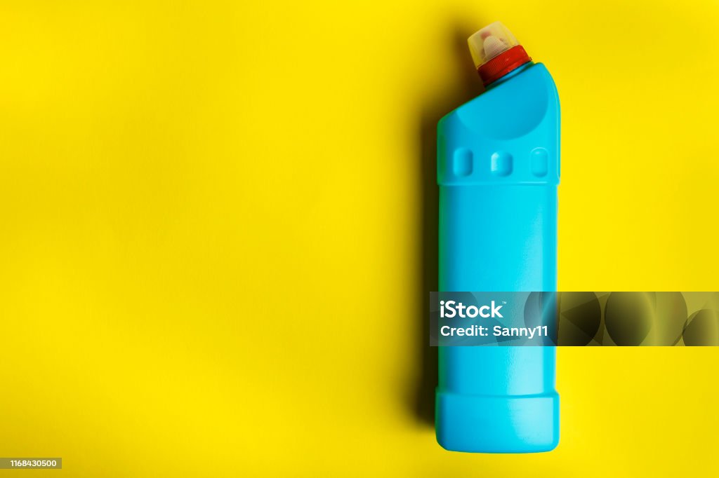 detergent bottle on bright yellow background. detergent bottle on bright yellow background. place for text Bathroom Stock Photo