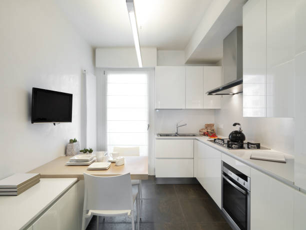 Structure of a modern small kitchen, hotel room interior.
