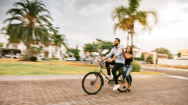 istock Couple riding bicycles in Mexico 1168431980