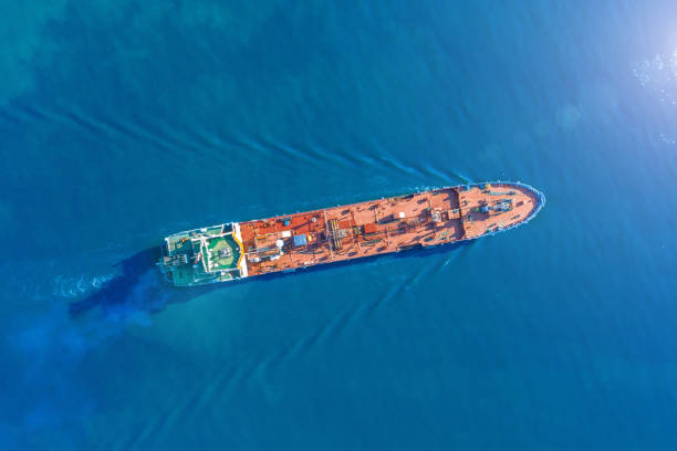 Aerial view tanker ship with liquid bulk cargo is sailing in blue water. Aerial view tanker ship with liquid bulk cargo is sailing in blue water heating oil photos stock pictures, royalty-free photos & images