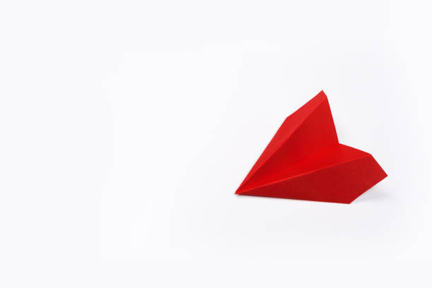 istock Red paper airplane isolated on white background 1168437030