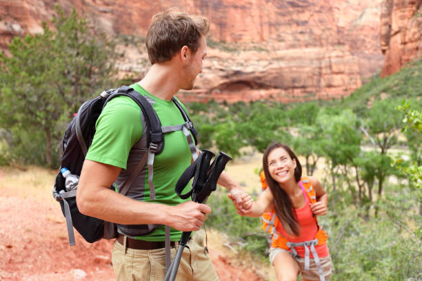 istock Helping hand - hiking woman getting help on hike 1168437168