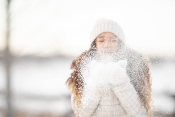 Winter girl in the snow outside.