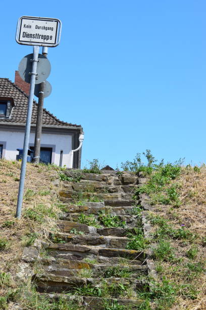 istock flood barrier stairway with warning sign 1168438396