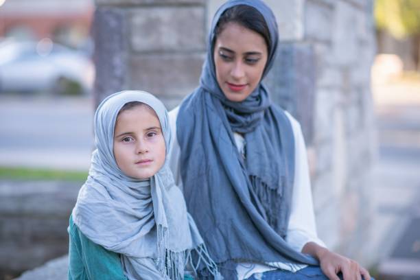 istock Muslim woman looking at her daughter 1168439481