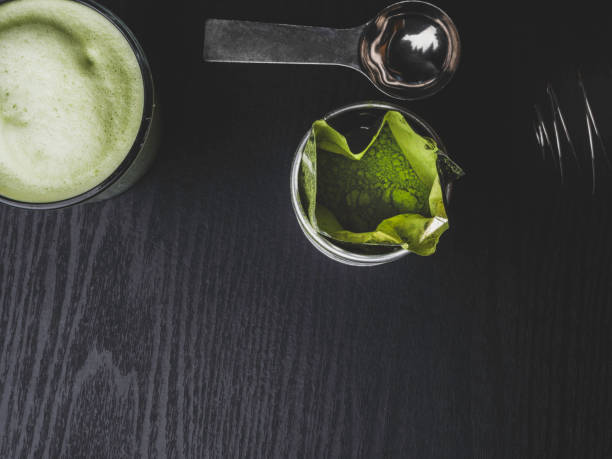 Matcha green tea latte in a cup. Detox concept, Top view. Copy space.