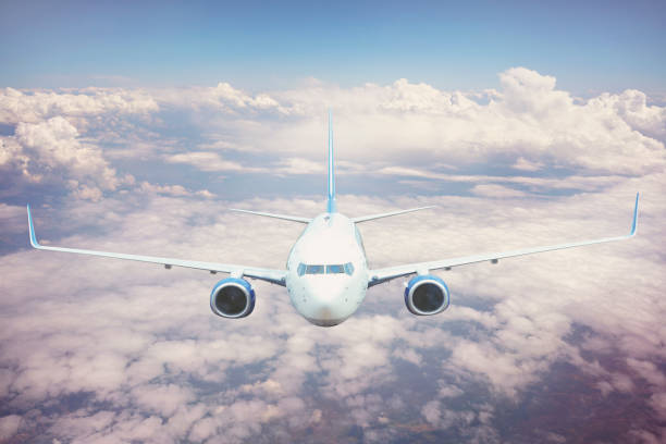 istock Passenger jet airplane flying above clouds. 1168440413