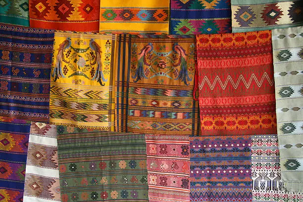 Photo of Three rows of colorful printed fabric in Guatemala for sale