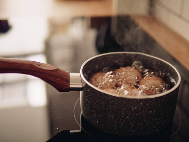 istock Senior woman making egg boiling in morning at home. 1168440611