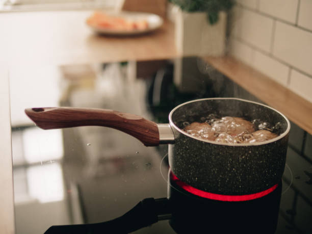 Grandmother preparing boiled egg in morning at home.