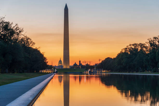 istock Sunrise over the Reflecting Pool in Washington DC with the Washington Monument 1168441521