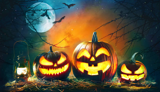 istock Halloween pumpkin head jack lantern with burning candles 1168441675