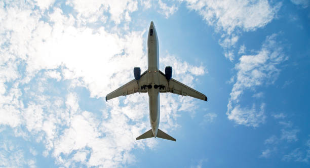 istock Passenger airplane in clear blue sky about to land 1168442966