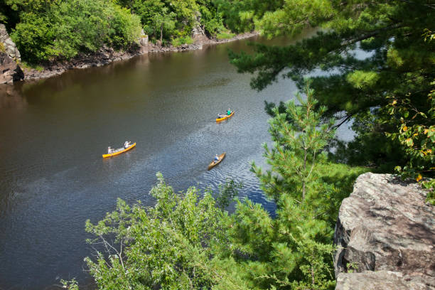 Canoes on the St Croix River between Minnesota and Wisconsin viewed from an overlook