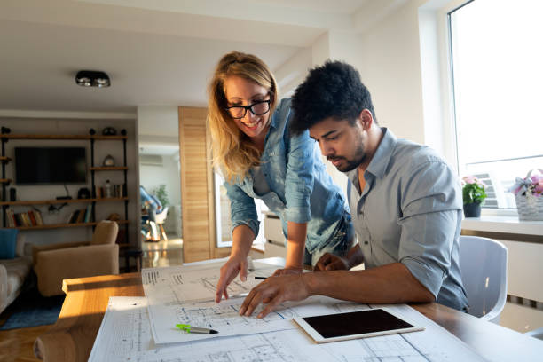 istock Office coworkers in business meeting discussing project plans 1168444776