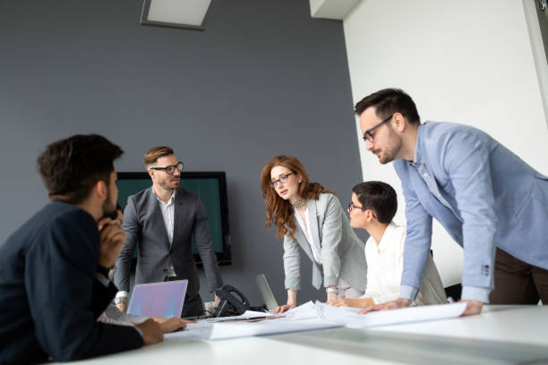 istock Group of architects and business people working together 1168446116