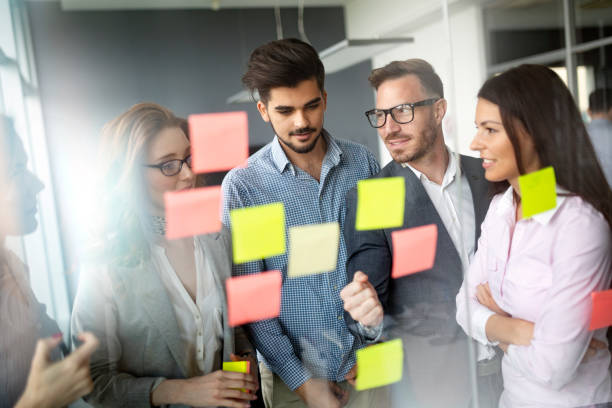 istock Business people planning strategy in office together 1168446272
