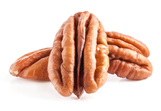 istock Peeled pecan nuts isolated on white background with clipping path 1168447273