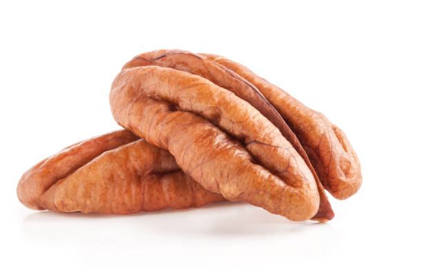 istock Peeled pecan nuts isolated on white background with clipping path 1168447295