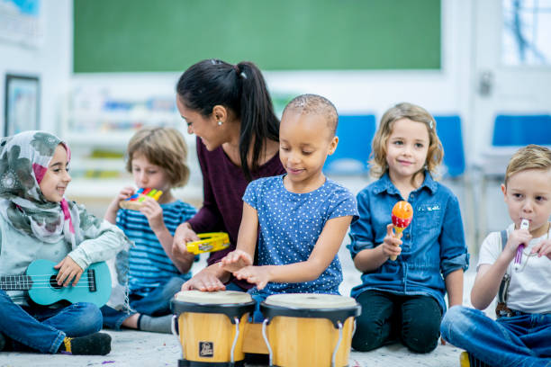 istock Diverse bunch of preschool kids playing instruments 1168447352