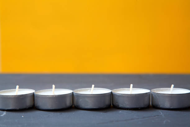istock Creative, bright idea and innovation or inspiration concept. Candles on yellow background 1168448205