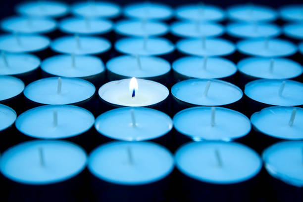 istock Creative, bright idea and innovation or inspiration concept. One candle burns, among others extinguished 1168448215
