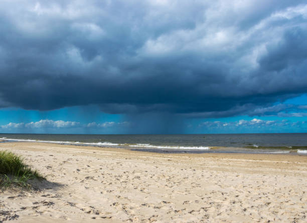 istock Dark rain clouds above the Baltic sea. Raining. 1168448462