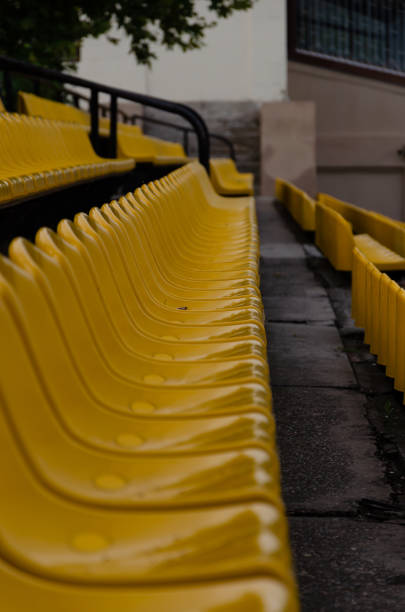 istock Empty plastic chairs at the stadium. Side view. Outdoors 1168448518