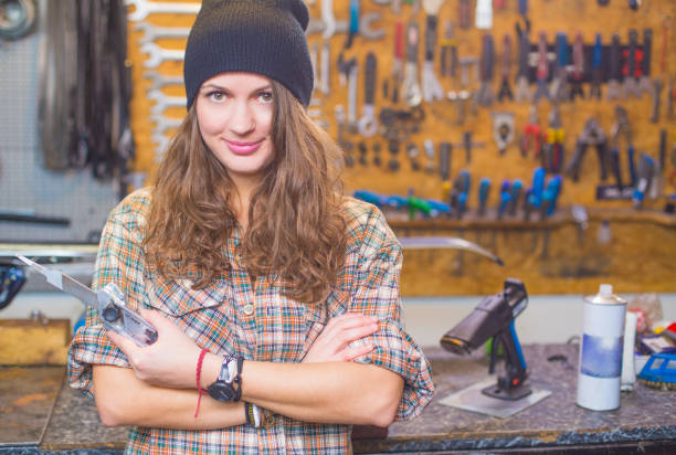 istock Pretty girl in the workshop with a tool 1168449547