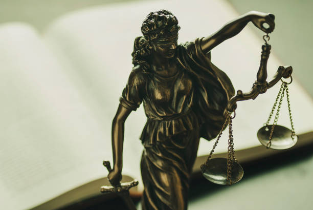 istock Brass statue of Justice with scales and sword 1168449740