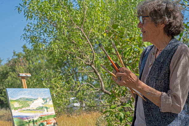 istock Mature woman studying her painting 1168450640