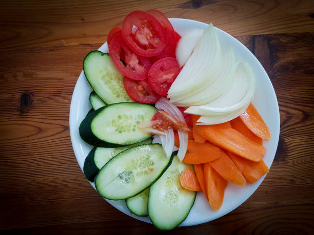istock Green vegetable salad served on china platter 1168450728