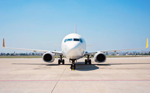 istock Front view of passenger airplane standing on runway. 1168452276