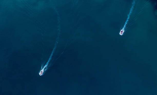 istock Boat trails in the sea 1168453586