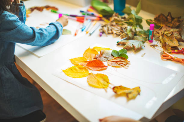 istock Children doing autumn handcrafts 1168454088
