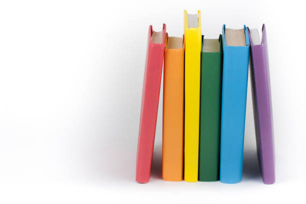 Book stacking. Open book, hardback books on white background. Back to school. Copy space for text. stock photo