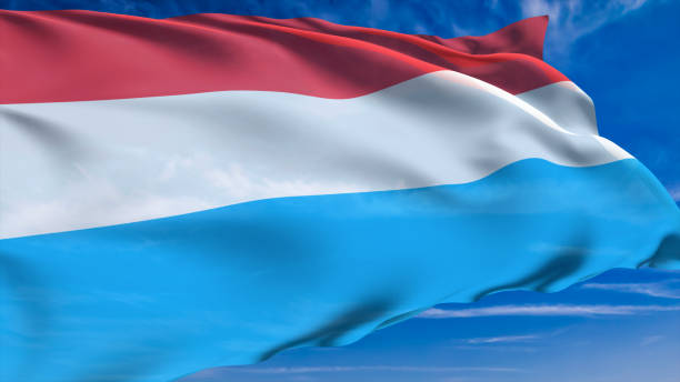 istock flag of Luxembourg with fabric structure against a cloudy sky 1168456435