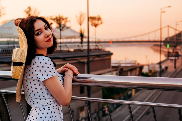 istock Elegant young lady walking outdoors in the city. Summer stroll. 1168456549