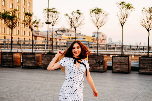 istock Elegant young lady walking outdoors in the city. Summer stroll. 1168456570