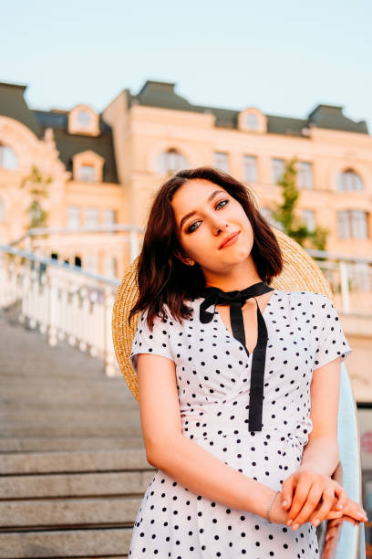 istock Elegant young lady walking outdoors in the city. Summer stroll. 1168456714